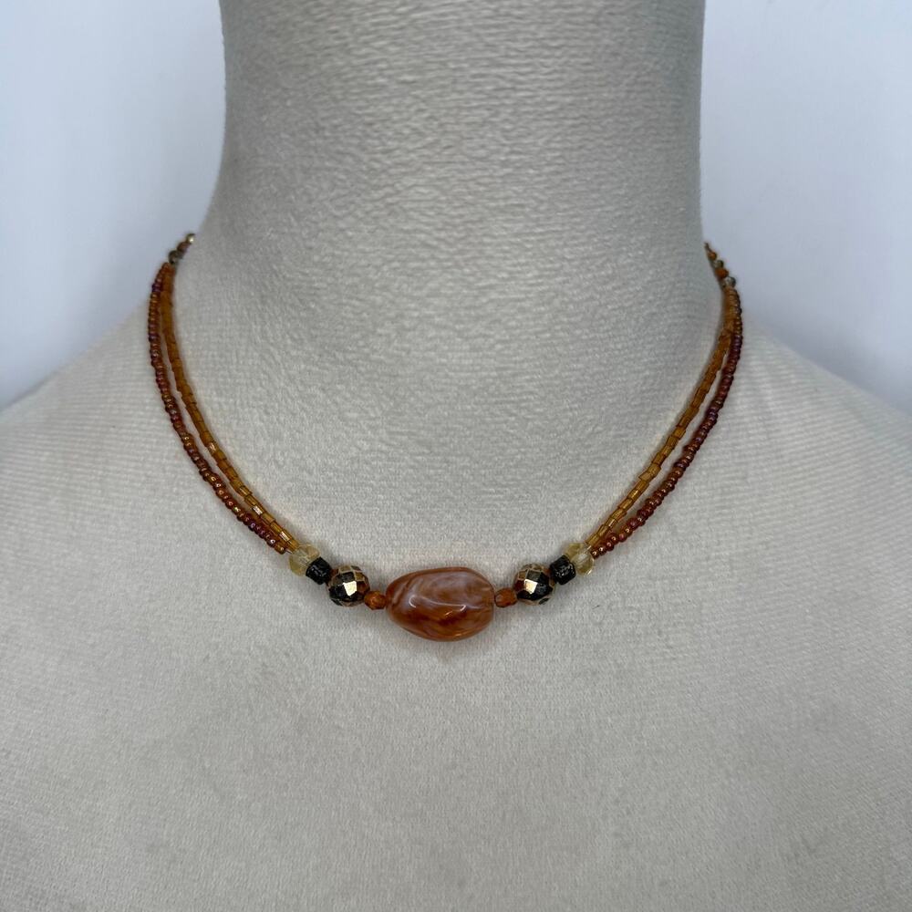 33. Orange beaded 2 strand necklace